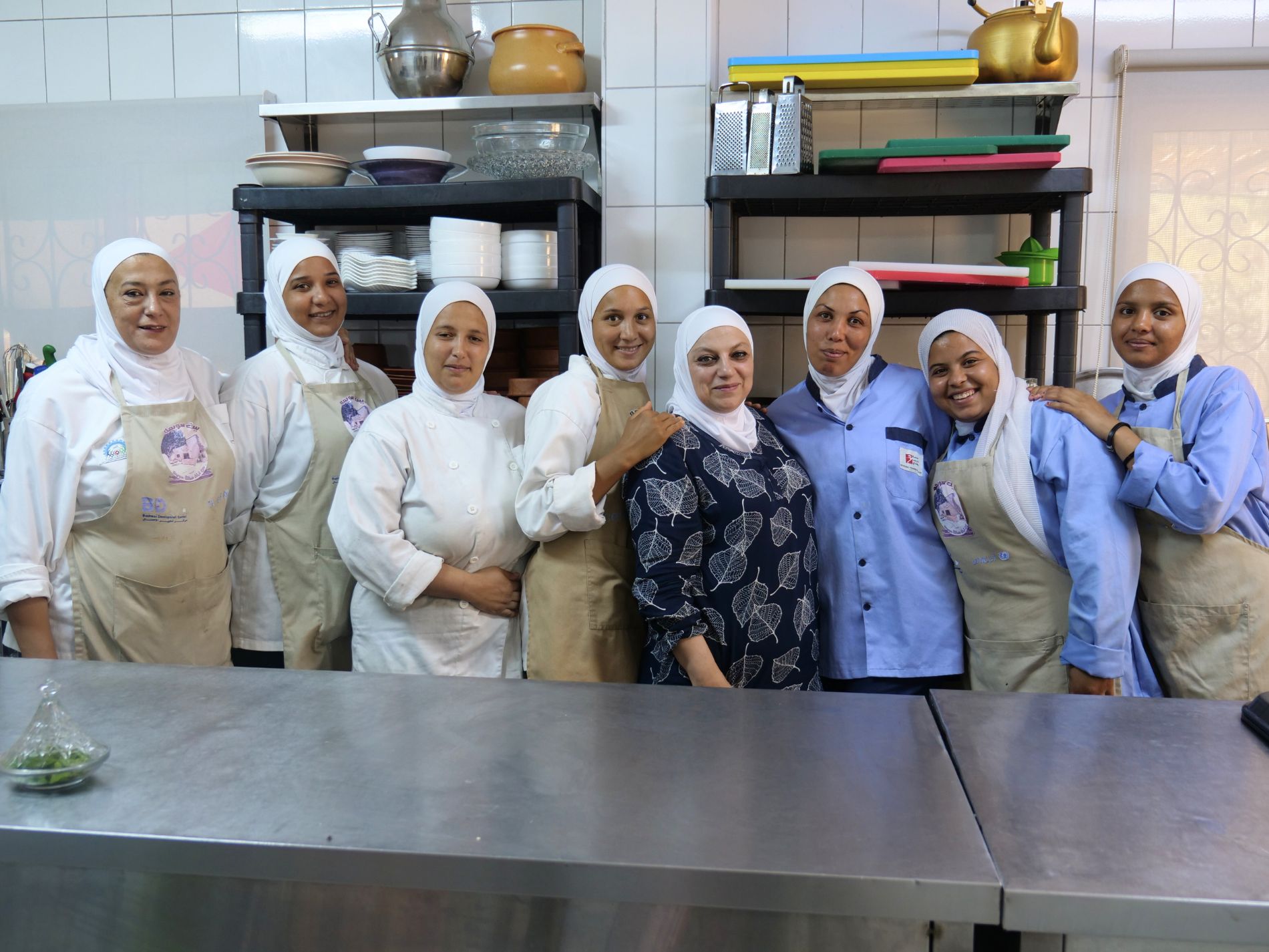 A group of women at Beit Sweimeh restaurant in Jordan Valley, making traditional food for tourists